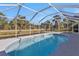 Relaxing screened-in pool with large patio at 7146 Sablon Rd, North Port, FL 34291