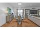 Elegant dining area featuring modern decor with a glass-topped table and chandelier lighting at 25228 Nocturne Ln, Punta Gorda, FL 33983