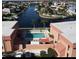 Aerial view of community pool and surrounding buildings at 1345 Mediterranean Dr # A203, Punta Gorda, FL 33950