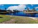 Scenic view of canal with lush landscaping and waterfront homes at 1345 Mediterranean Dr # A203, Punta Gorda, FL 33950