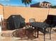 Private patio with table, chairs, and covered grill at 1345 Mediterranean Dr # A203, Punta Gorda, FL 33950