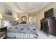 Bright bedroom with a king-size bed and ample closet space at 219 White Marsh Ln, Rotonda West, FL 33947