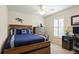 Bedroom with a workspace and wooden bed at 219 White Marsh Ln, Rotonda West, FL 33947