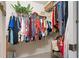 Well-organized walk-in closet with shelving for shoes and accessories at 219 White Marsh Ln, Rotonda West, FL 33947