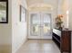 Bright and airy entryway with tile flooring and a console table at 219 White Marsh Ln, Rotonda West, FL 33947