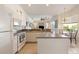 Modern kitchen with white cabinets and ample counter space at 219 White Marsh Ln, Rotonda West, FL 33947