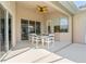 Covered patio with table and chairs, ideal for outdoor dining at 219 White Marsh Ln, Rotonda West, FL 33947