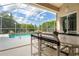 Screened lanai overlooking refreshing pool at 219 White Marsh Ln, Rotonda West, FL 33947