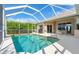 Refreshing screened pool perfect for relaxation at 219 White Marsh Ln, Rotonda West, FL 33947