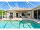 Relaxing screened pool with grilling area at 219 White Marsh Ln, Rotonda West, FL 33947