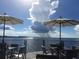 Enjoy waterfront dining under umbrellas with gorgeous water views at 219 White Marsh Ln, Rotonda West, FL 33947