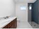 Bathroom with single vanity and walk-in shower at 425 Orinoco St, Punta Gorda, FL 33983