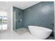 Bathroom with freestanding tub and blue tile at 425 Orinoco St, Punta Gorda, FL 33983