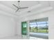 Bright bedroom with sliding glass doors opening to a pool view at 425 Orinoco St, Punta Gorda, FL 33983