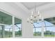 Elegant dining room with chandelier and large windows at 425 Orinoco St, Punta Gorda, FL 33983