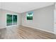 Bright bedroom featuring sliding glass doors and a window for natural light at 1190 Victoria Ave Nw, Port Charlotte, FL 33948
