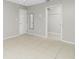 Spacious bedroom featuring tile flooring, neutral paint, and closet at 1190 Victoria Ave Nw, Port Charlotte, FL 33948