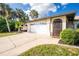 Exterior of home showing driveway, garage, and front door at 1190 Victoria Ave Nw, Port Charlotte, FL 33948