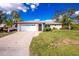 Exterior of home showing driveway, garage, and front door at 1190 Victoria Ave Nw, Port Charlotte, FL 33948