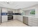 Well-equipped kitchen with stainless steel appliances and open layout at 1190 Victoria Ave Nw, Port Charlotte, FL 33948