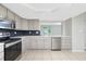 Contemporary kitchen with stainless steel appliances and plenty of counter space at 1190 Victoria Ave Nw, Port Charlotte, FL 33948