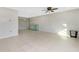 Spacious living room showcasing a vintage hutch and ceramic tile floors at 1190 Victoria Ave Nw, Port Charlotte, FL 33948