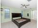 Spacious main bedroom featuring a ceiling fan and tile flooring at 1190 Victoria Ave Nw, Port Charlotte, FL 33948