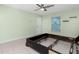 Main bedroom showcases a ceiling fan and tile flooring at 1190 Victoria Ave Nw, Port Charlotte, FL 33948