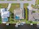 Bird's eye view of waterfront home with pool and dock at 138 Peckham Sw St, Port Charlotte, FL 33952