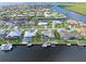 Bird's eye view of waterfront homes and lush landscape at 138 Peckham Sw St, Port Charlotte, FL 33952