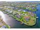 Aerial view of waterfront home with private dock and pool at 138 Peckham Sw St, Port Charlotte, FL 33952