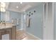 Elegant bathroom with double vanity and walk-in shower at 138 Peckham Sw St, Port Charlotte, FL 33952