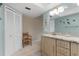 Bathroom with double vanity and linen closet at 138 Peckham Sw St, Port Charlotte, FL 33952