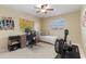 Home office and bedroom combo with window and rowing machine at 138 Peckham Sw St, Port Charlotte, FL 33952
