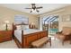 Bedroom with pool view, bamboo bed frame, and wicker furniture at 138 Peckham Sw St, Port Charlotte, FL 33952