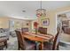 Elegant dining room with wooden table, seating for six, open to living room at 138 Peckham Sw St, Port Charlotte, FL 33952