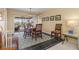 Dining room with table and chairs, leading to a view of the pool area at 138 Peckham Sw St, Port Charlotte, FL 33952