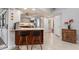 Kitchen with breakfast bar, stainless steel appliances, view to backyard at 138 Peckham Sw St, Port Charlotte, FL 33952