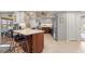 Open concept kitchen with breakfast bar and stainless steel appliances at 138 Peckham Sw St, Port Charlotte, FL 33952