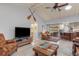 Spacious living room with vaulted ceiling, fireplace and large TV at 138 Peckham Sw St, Port Charlotte, FL 33952