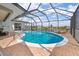 Inviting screened pool with canal views; perfect for relaxation at 138 Peckham Sw St, Port Charlotte, FL 33952