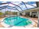 Enclosed kidney-shaped pool with canal views at 138 Peckham Sw St, Port Charlotte, FL 33952