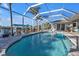 Refreshing pool and screened enclosure, perfect for outdoor living at 18061 Cullman Ave, Port Charlotte, FL 33948