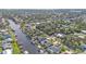 Aerial view of canal-front home and neighborhood at 18491 Hottelet Cir, Port Charlotte, FL 33948