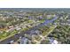 Aerial view of canal-front home in a residential neighborhood at 18491 Hottelet Cir, Port Charlotte, FL 33948