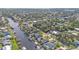 Aerial close-up of canal-front house and backyard at 18491 Hottelet Cir, Port Charlotte, FL 33948