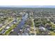 Aerial view showcasing waterfront property and community at 18491 Hottelet Cir, Port Charlotte, FL 33948