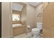 Bathroom with tan tile, a bathtub, and toilet at 18491 Hottelet Cir, Port Charlotte, FL 33948