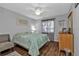Bedroom with teal bedding and wood flooring at 18491 Hottelet Cir, Port Charlotte, FL 33948
