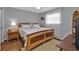 Bedroom with wood bed frame and wood flooring at 18491 Hottelet Cir, Port Charlotte, FL 33948